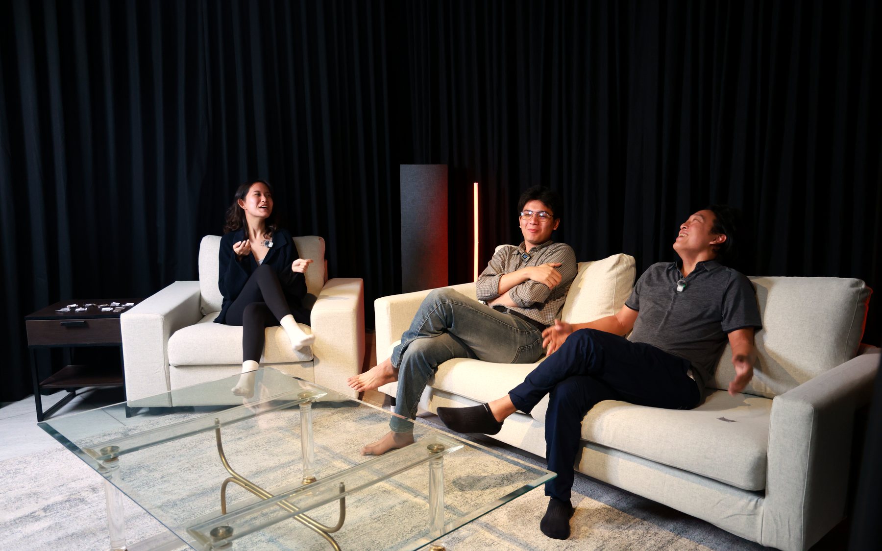 Guests laughing together between takes at Rhumb Studio
